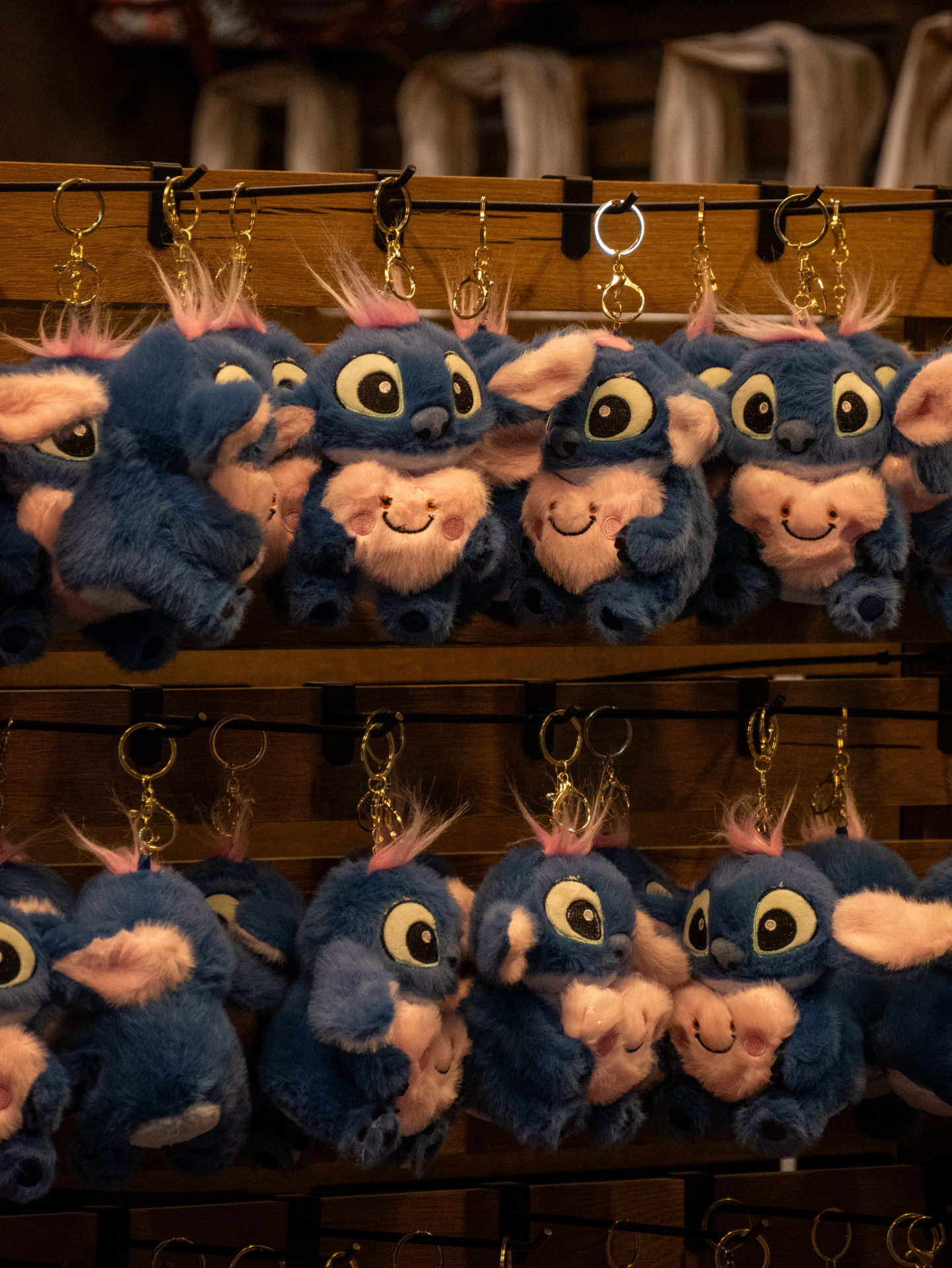 Row of small blue character plush keychains