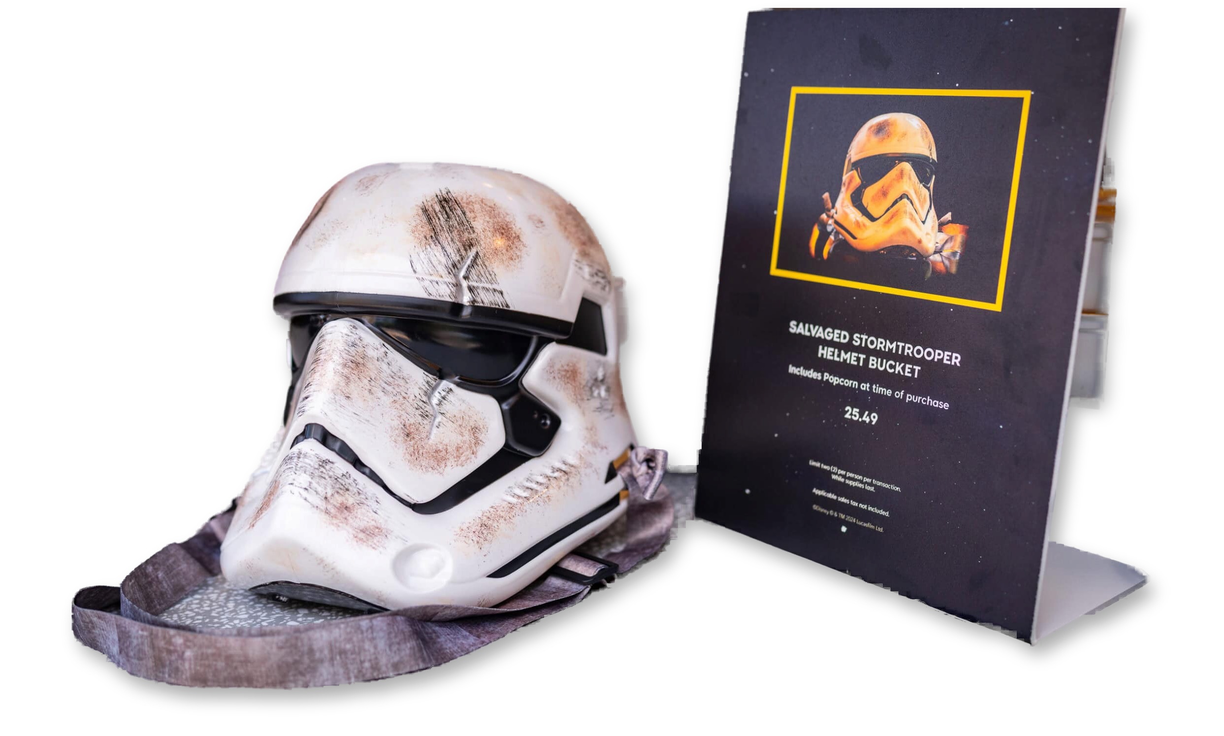 Weathered, battle-damaged Stormtrooper helmet-shaped popcorn bucket with detachable strap