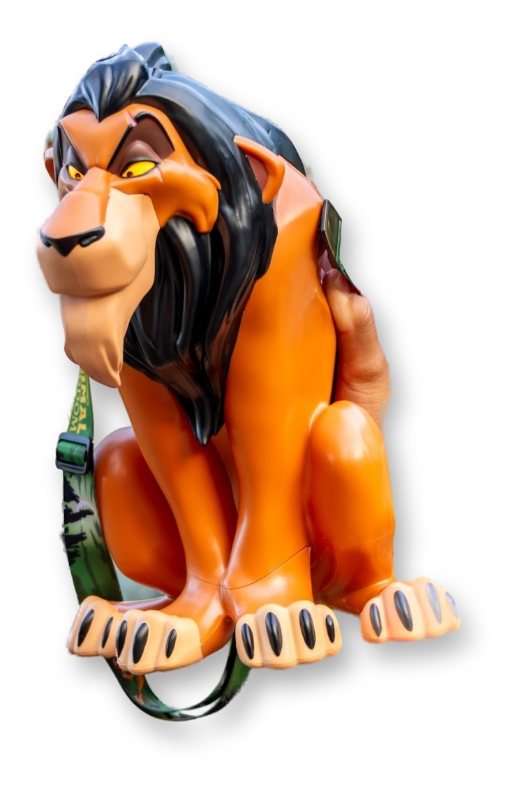 Orange popcorn bucket sculpted as Scar's head and front paws with a dark mane, held up outside a mosaic-decorated building at Disney's Animal Kingdom.