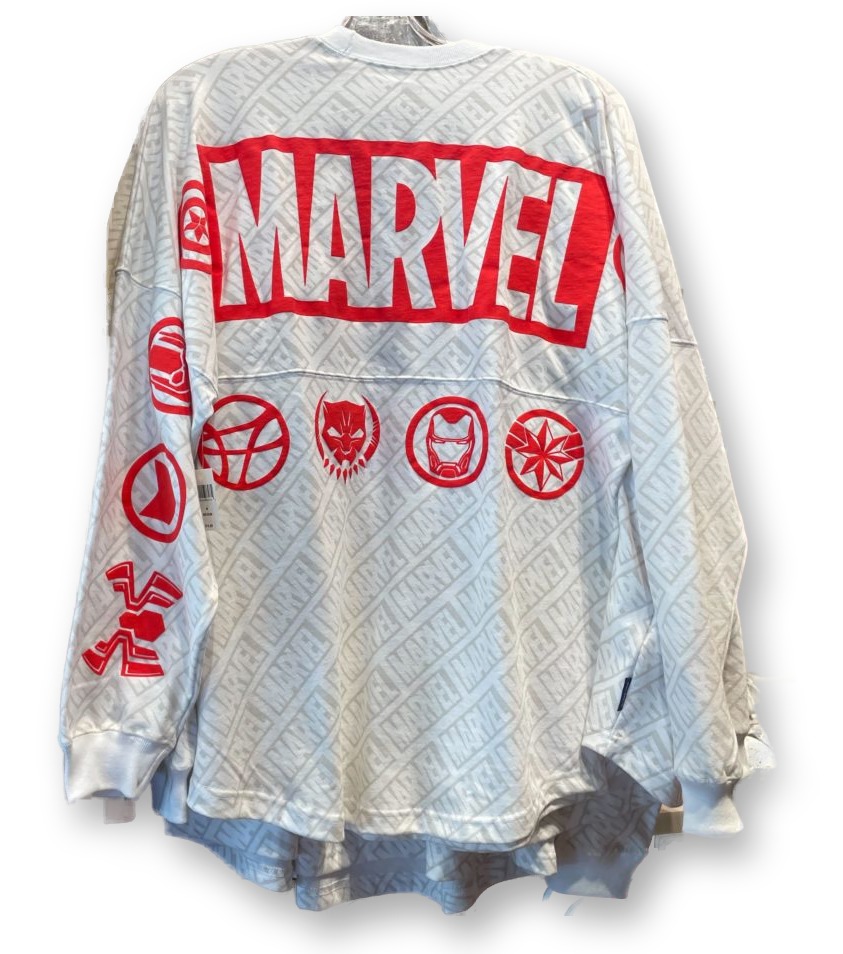 Back of a white Spirit Jersey on a mannequin, featuring a large red MARVEL logo across the shoulders and red superhero icon graphics down the sleeves and back.