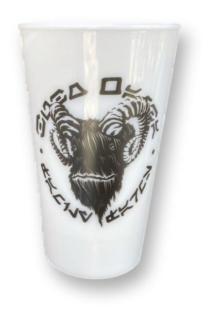 White semi-translucent souvenir cup printed with a bantha-head logo and Aurebesh text for Bubo Wamba Family Farms, on the Milk Stand counter in Star Wars: Galaxy's Edge